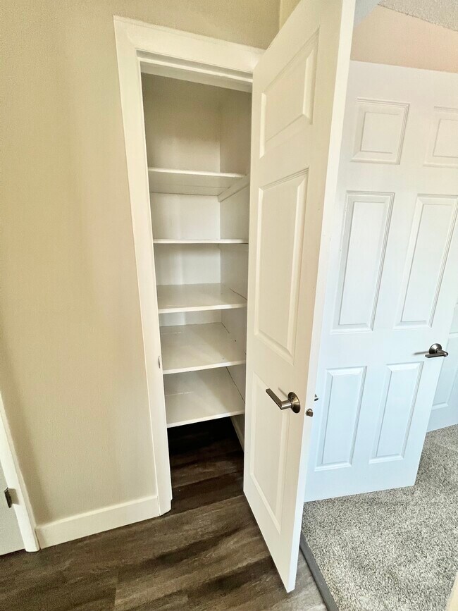 Explore the ample storage space with this conveniently designed closet. - Wadsworth Station West