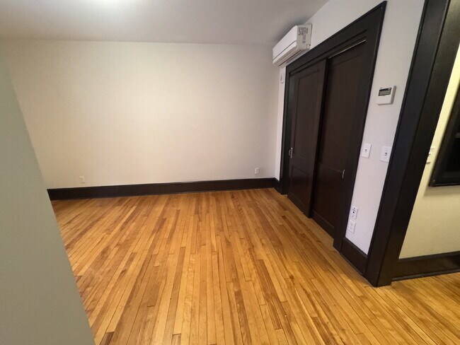 Building Photo - "Charming Studio Retreat with Hardwood Elegance in Downtown Minneapolis!"