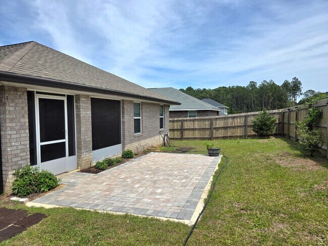 Building Photo - Bright, Open Layout | Screened Porch + Paver Patio | Move-In Ready
