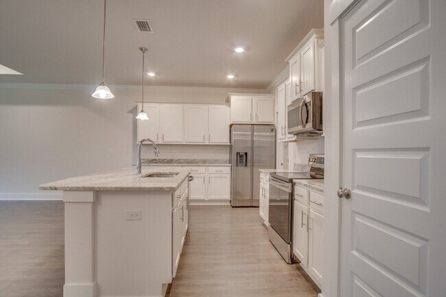 Building Photo - Spacious Cantonment Townhome with Open Layout, 2-Car Garage, Covered Back Porch & Easy Access to ...