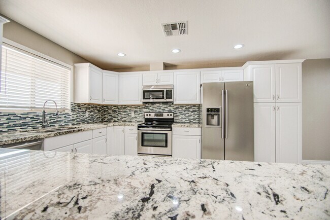 Building Photo - Beautifully remodeled corner 4/2 with pool...