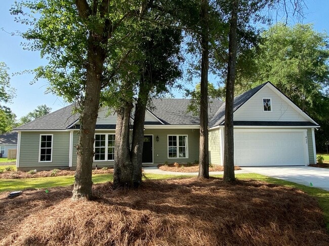 Building Photo - Modern 4-Bedroom Home with Fenced Yard Nea...