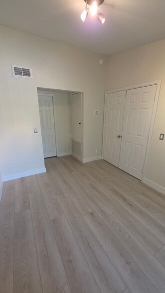 2nd Bedroom toward half bath and laundry - 1351 N Pleasant Dr