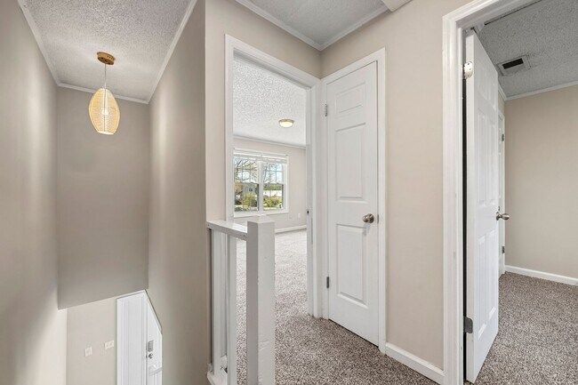 Building Photo - Introducing a Charming End Unit Townhouse ...