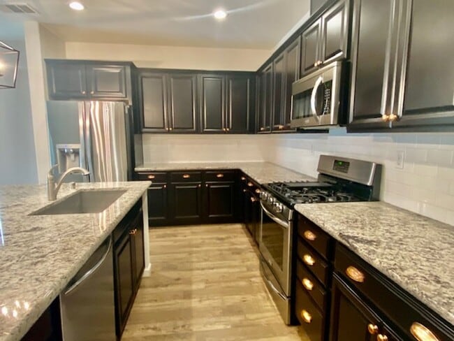 Building Photo - ALMOST NEW, UNIQUE 4 BEDROOM, 3 BATH, 2 CA...