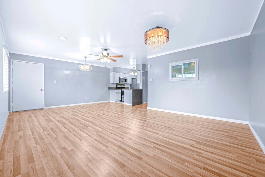 Living room with beautiful chandelier - 12801 Moorpark St