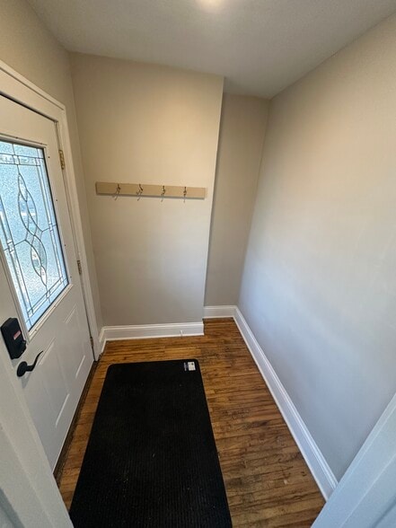 Large front entry with plenty of room for a bench - 235 Logan Ave N