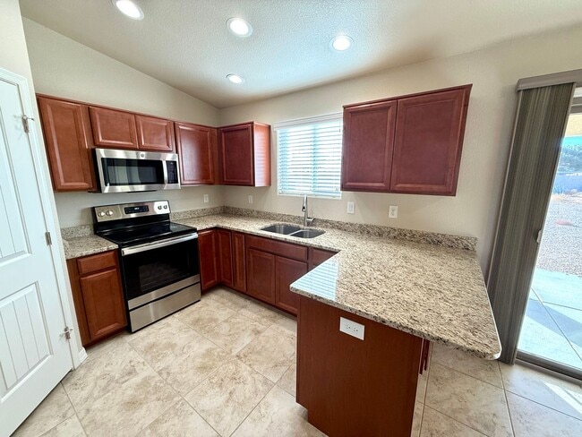 Building Photo - Great 4 Bedroom Home with Drive Through Side Gate!