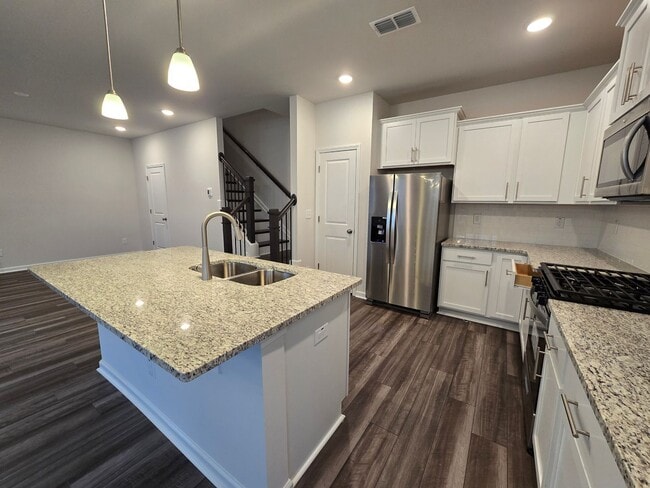 Building Photo - NEWLY BUILT END UNIT TOWNHOME