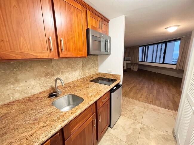 Building Photo - (INCLUDING UTILITIES, A/C & INTERNET) Studio Unit with 1 parking available Waikiki Marina!!
