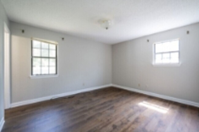 Building Photo - This beautifully updated brick home in Har...