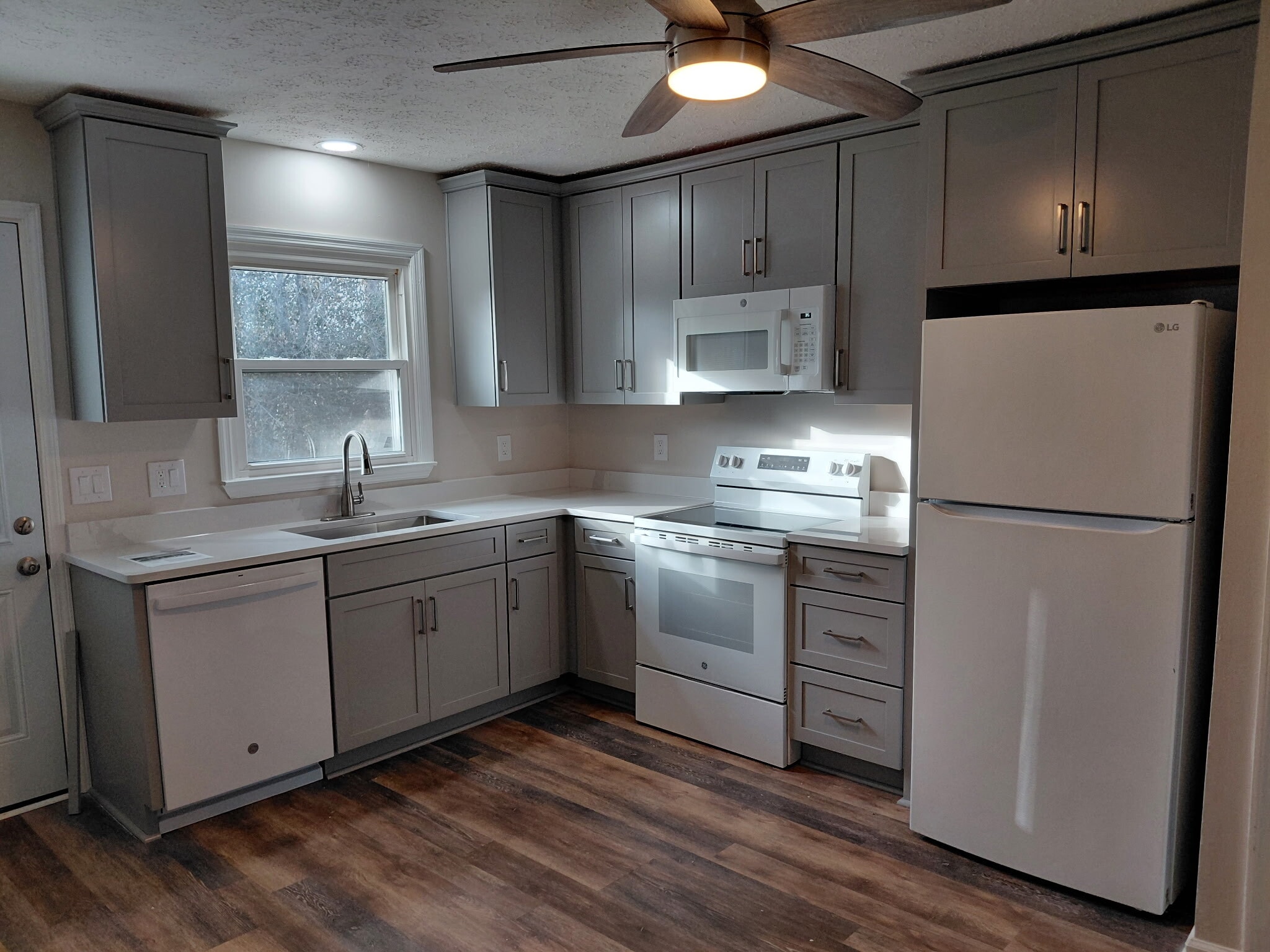 New cabinets, dishwasher, new sink, microwave, quartz counter top, new paint - 111 Cash Ln