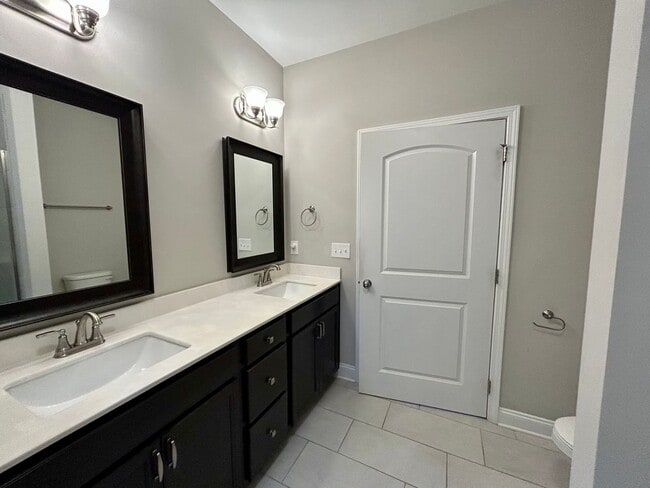 Building Photo - Spacious 3 bed, 3 bath home in Groves Park Commons featuring a modern kitchen, 2-car garage, and ...