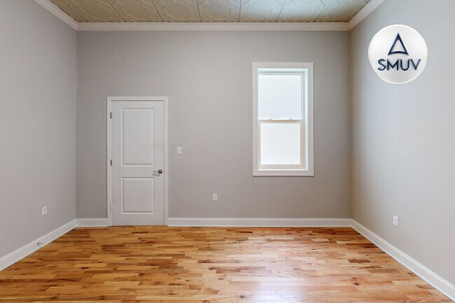 Building Photo - 100 West Lexington-209