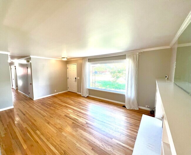 Lots of light and beautiful views through the living room picture window - 3096 S Marie Cir