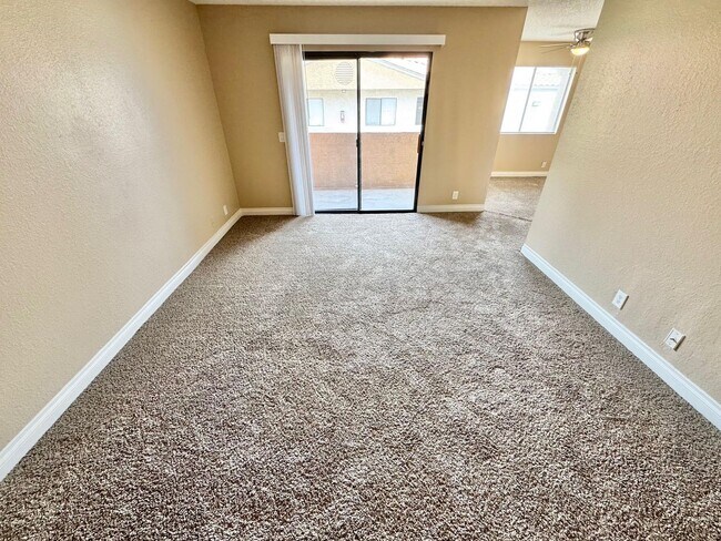 Building Photo - THIS SECOND-FLOOR DESERT SHORES CONDO OFFE...