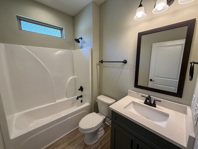 Building Photo - Spacious 3 Bedroom 2 Bath + Office with Split Floor Plan & Screened Patio in Pace!