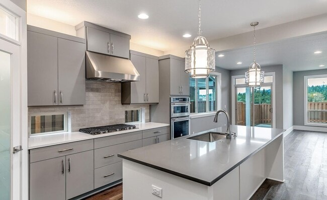 Building Photo - Bethany Stunner - 5 Bedrooms with Main-Level Bed & Bath, Modern Kitchen & Private Fenced Yard