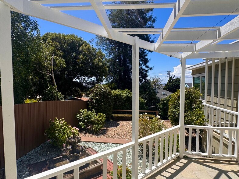 Layered outdoor spaces connect the atrium, fountain garden, and other levels surrounding landscaping - 2403 Mira Vista Dr