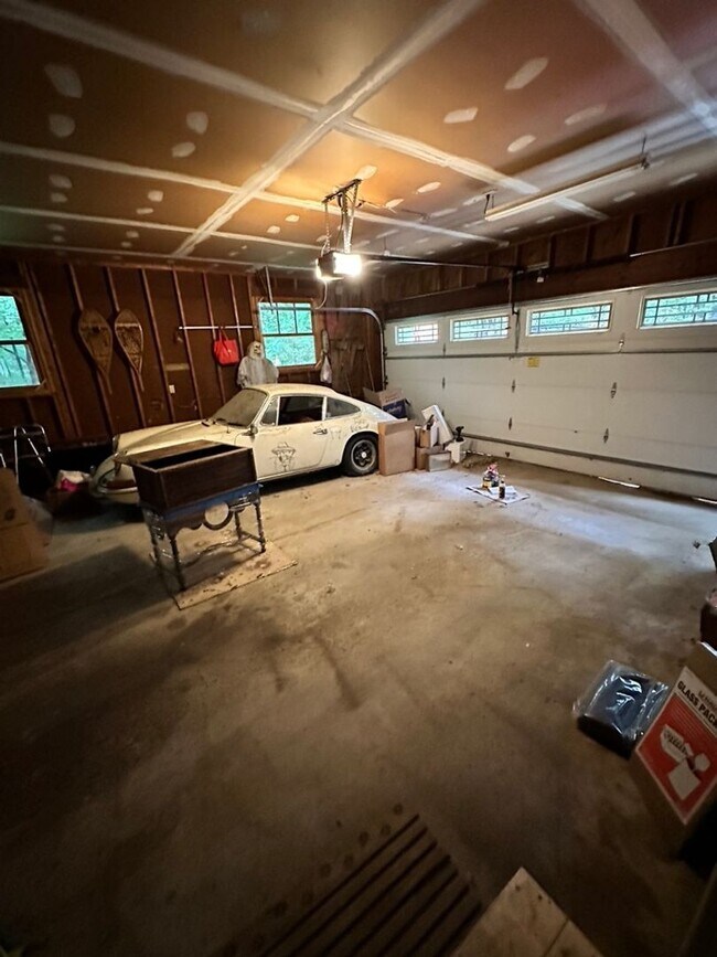 Building Photo - Dream Home in Highland, Michigan: Your Private Oasis on 5 Wooded Acres