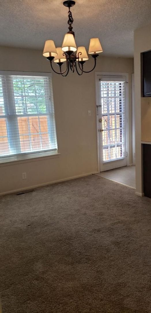 Building Photo - 2 Bedroom Ranch Style End Unit Condo