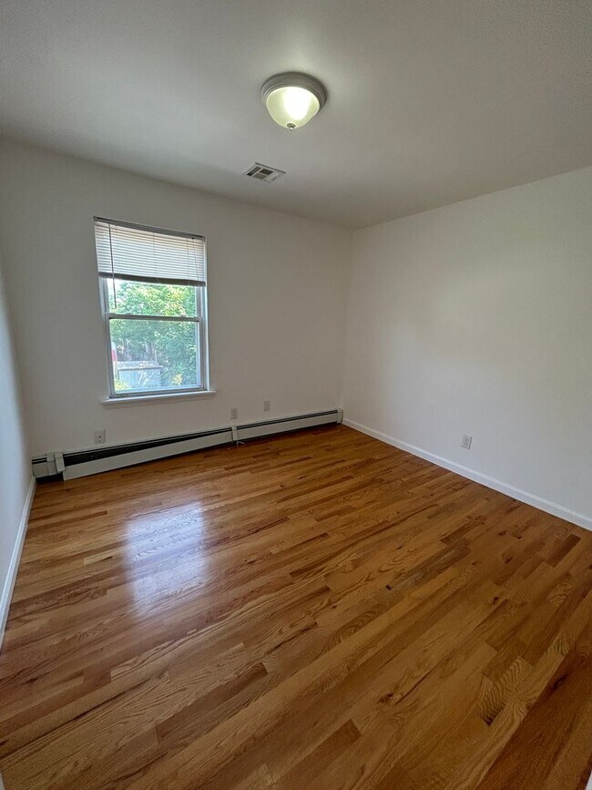 Building Photo - Discover Your Dream Home in Neptune: Spacious 4-Bedroom, 2.5-Bath with Private Backyard and Drive...