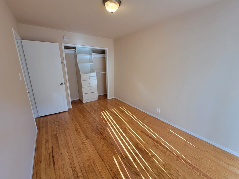 Bedroom 1 closet with built in organizer - 2227 Roosevelt Ave