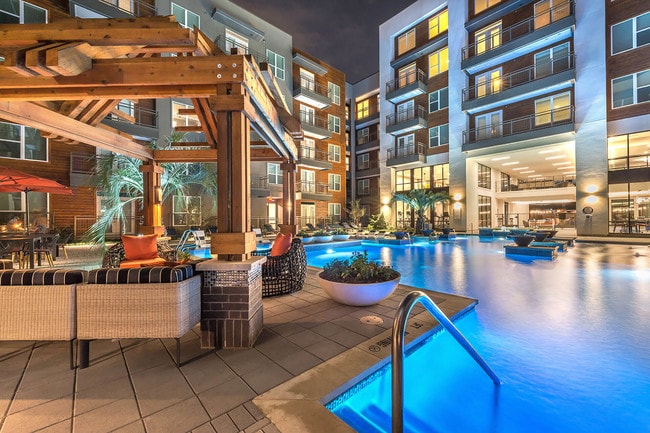 Outdoor lounge overlooking our resort-inspired pool - Windsor by the Galleria