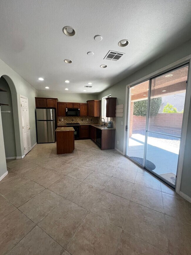 Building Photo - Spacious 4-Bedroom Mountains Edge Home with Downstairs Suite, Balcony & Covered Patio