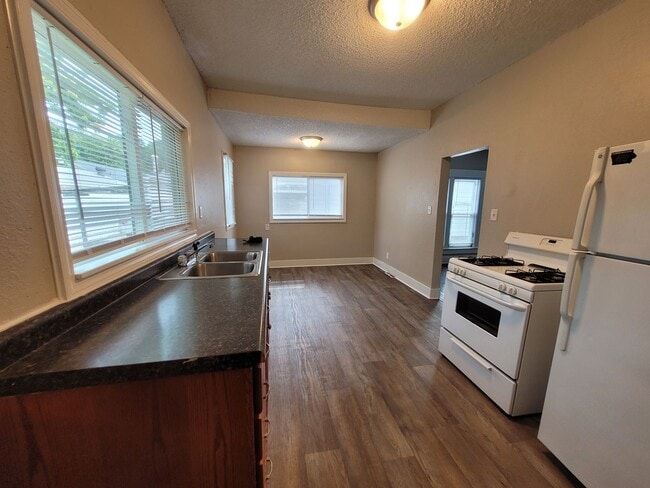 Building Photo - Two bedroom home with partially fenced yard!