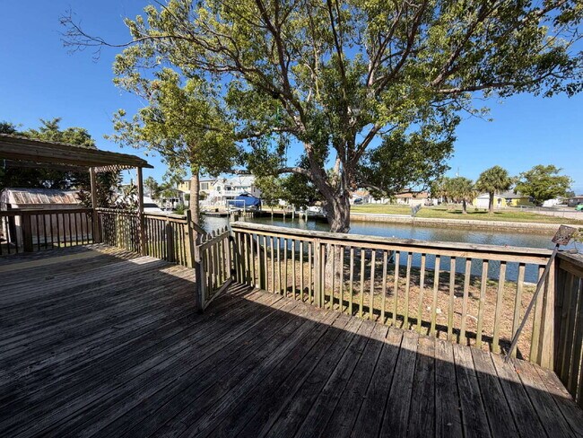 Building Photo - "Waterfront Home with Dock! 3-Bedroom Oasis with 2 Baths and 1,800 Sq Ft of Comfort in Hudson, FL!"