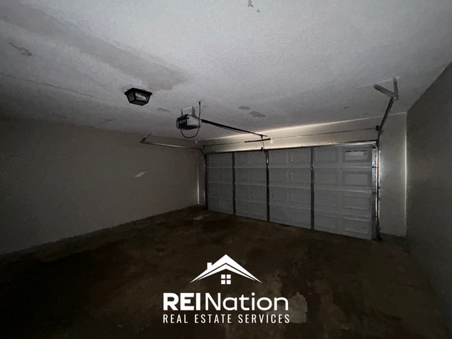Building Photo - Spacious 4BR/2BA Near Southwind | High Ceilings, Brick Fireplace & 2-Car Garage