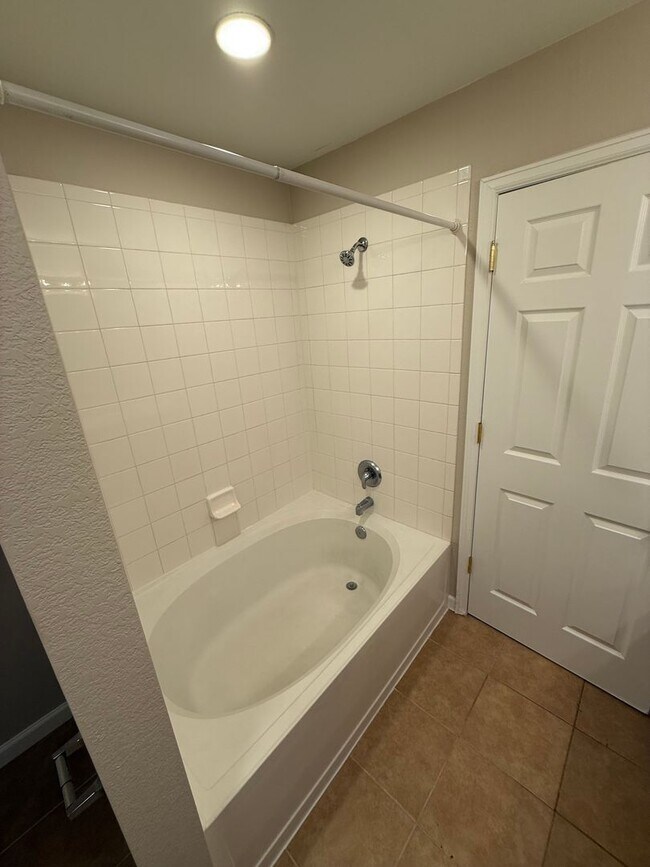 Building Photo - Spacious 4-bed, 3-bath home on a quiet cul-de-sac — no lawn maintenance required.