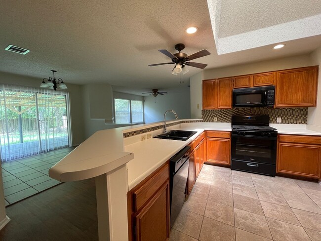 Building Photo - SPACIOUS HOME - NEW FLOORING! - 2 LIVING A...