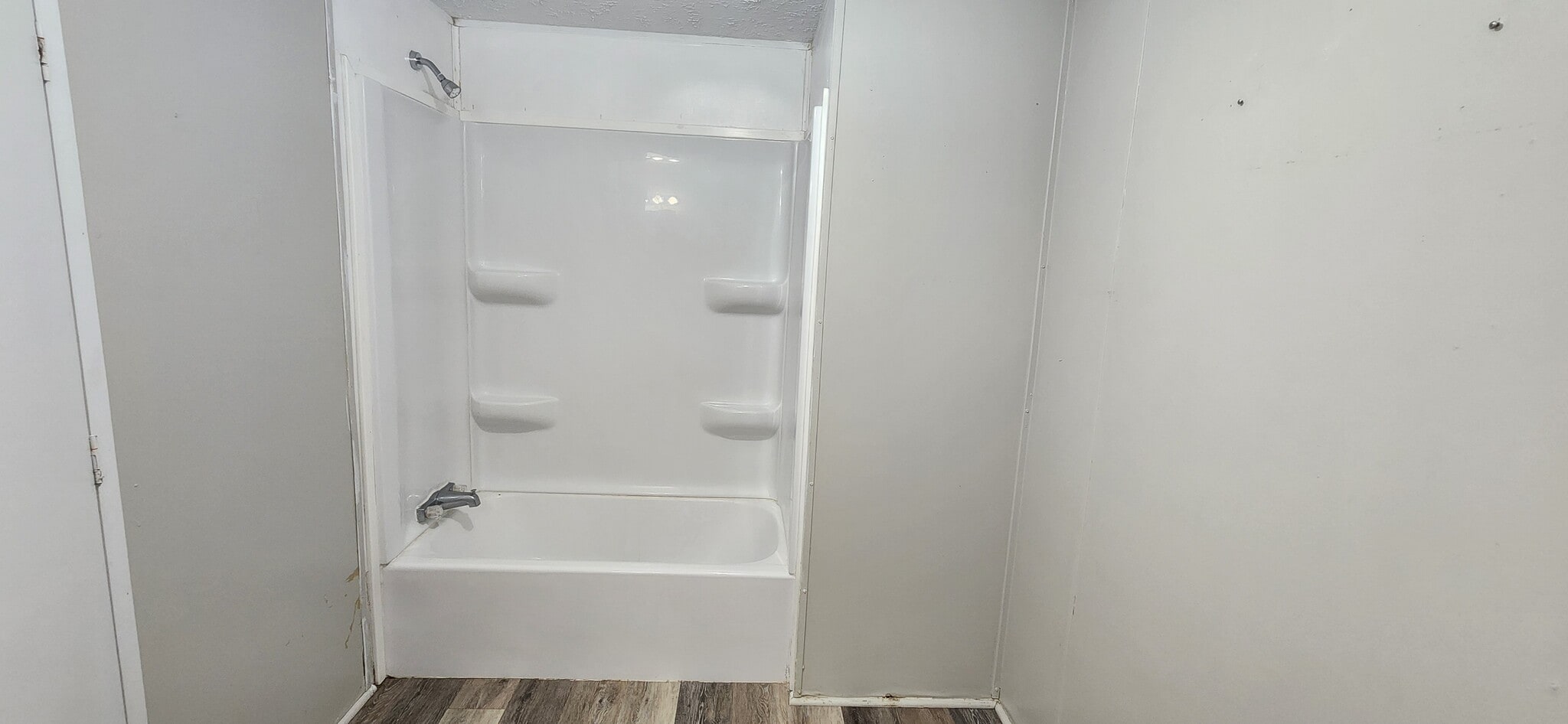 new tub and surround and flooring - 120 Pecan St