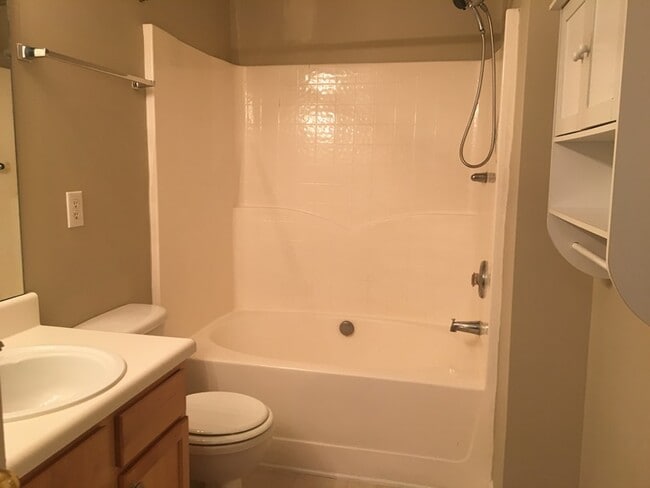 Building Photo - Gas Fireplace! Fenced-in Patio! Storage Space!