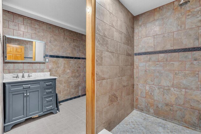 Building Photo - Charming home with large garage & attached...