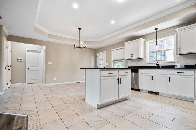 Building Photo - Pet Friendly Three Bedroom with Bonus!