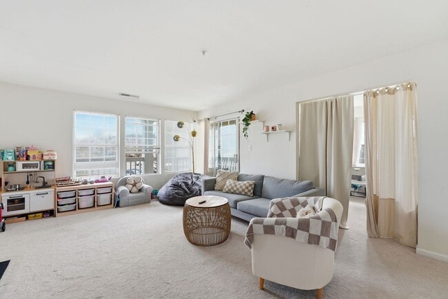 Building Photo - Bathed in natural light, this stunning second level condominium offers an effortless blend of com...