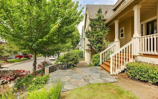 Building Photo - Spacious Four-Bedroom Home with Gourmet Kitchen, Multiple Living Areas, Loft, and Beautifully Lan...