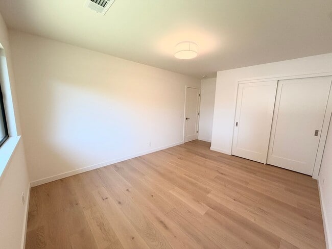 Building Photo - This premier 4-bed, 3-bath estate spans 2,565 sq. ft. on a 10,253 sq. ft. lot in North Los Altos.