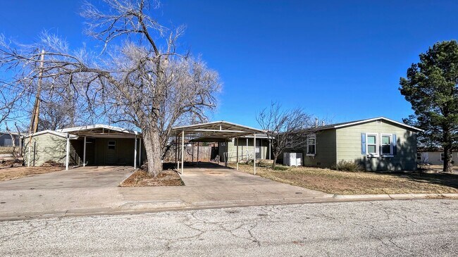 Building Photo - Your New Snyder Sanctuary: Modern Updates, Massive Storage & a Cozy Porch