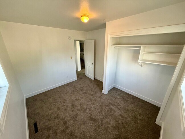 Building Photo - For Rent: 2 Bedroom, 1 Bathroom Home with Garage and Large Yard