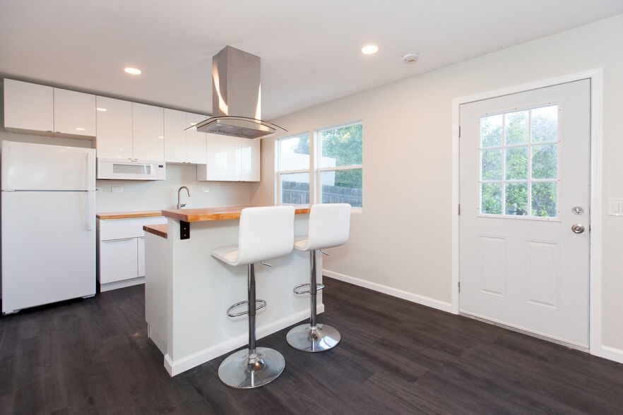 Modern space comes partially furnished with barstools - 4358 Aragon Dr