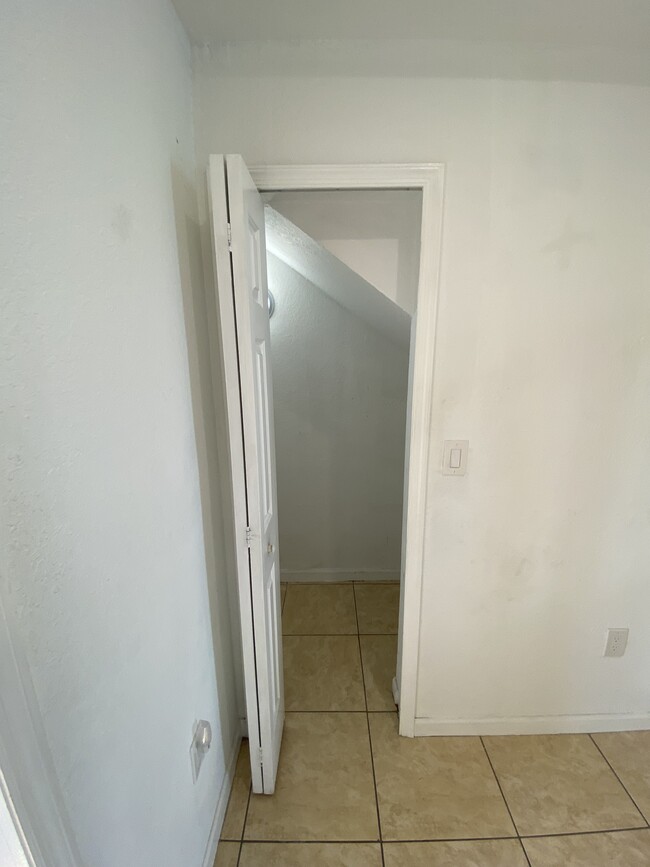 Closet below stairs: - 2451 SE 14th Ave