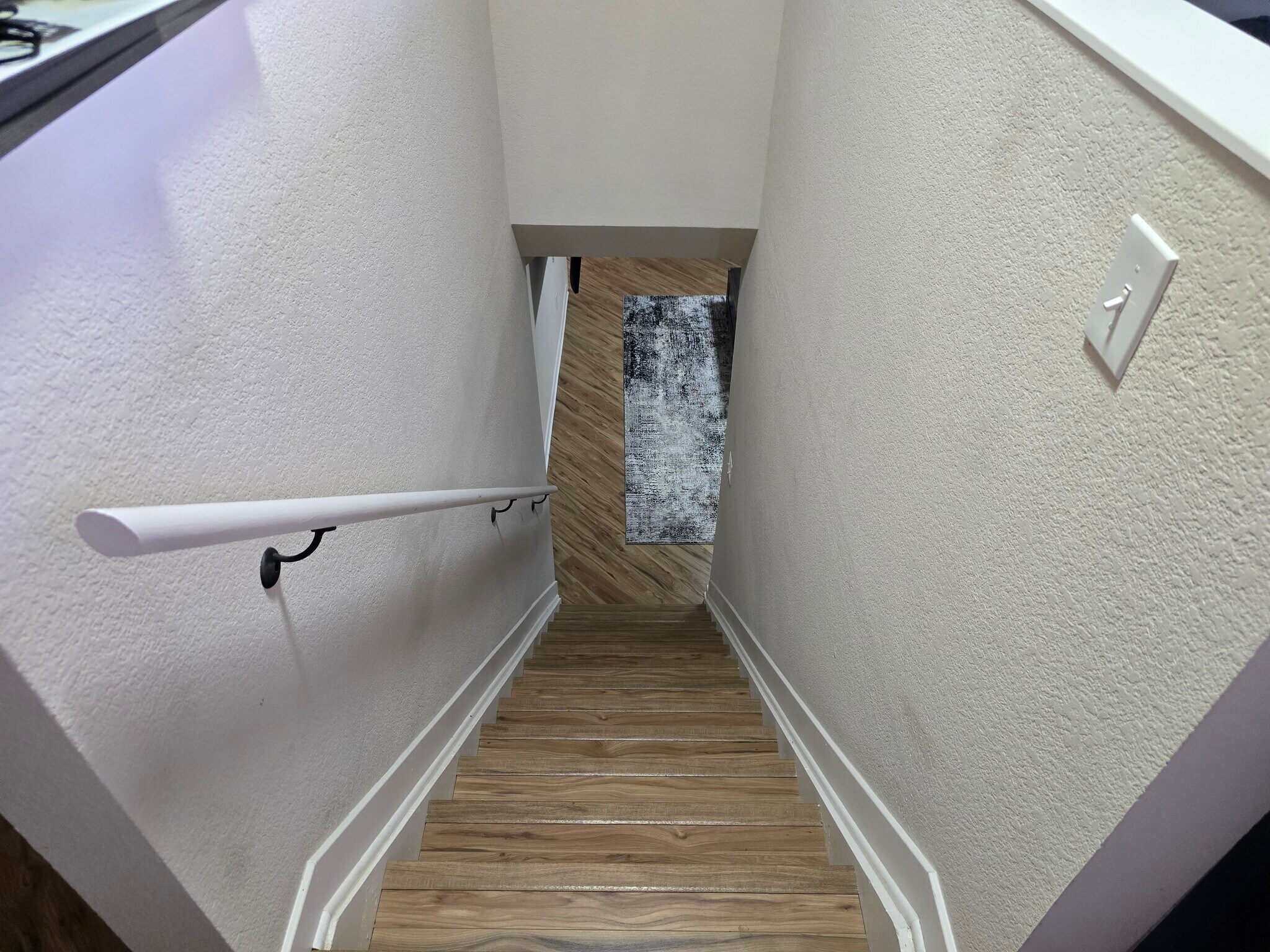 Transition to downstairs bedroom and living room. - 902 S Zephyr Ct