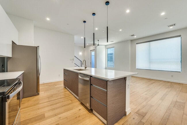 Building Photo - Live Above It All | Sleek Multi-Level Condo with Private Rooftop Deck