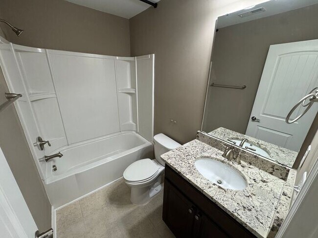 Building Photo - Like new 3 Bedroom townhouse with 2 car ga...