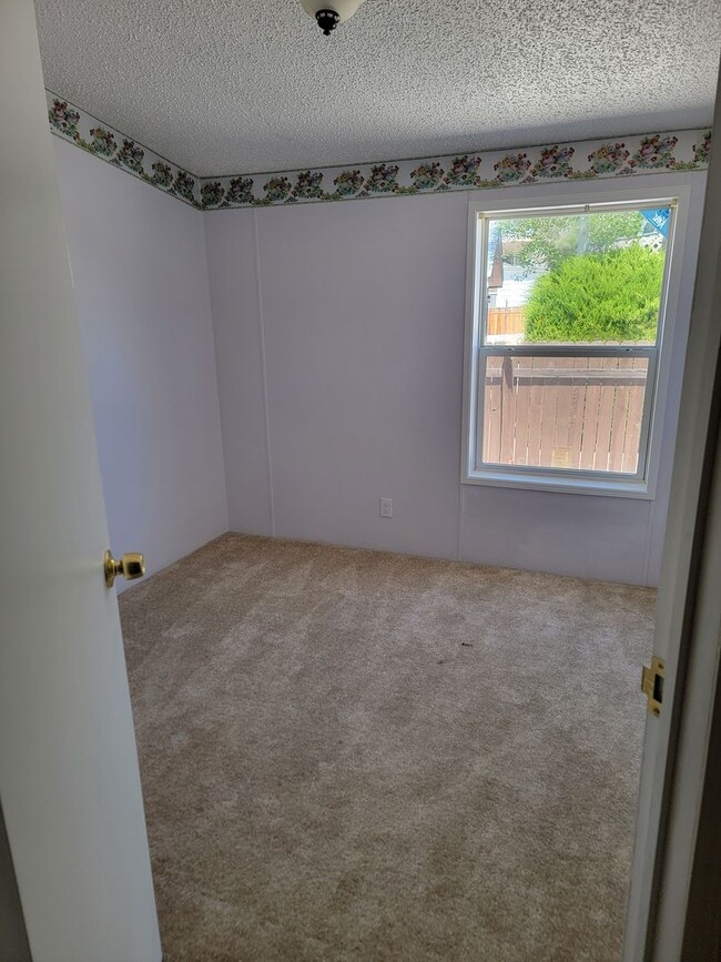 Building Photo - Bright 3-Bed, 2-Bath Home with Yard in 55+...