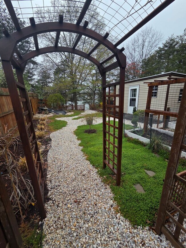 Building Photo - Serene Living in a Quiet Lakeside Community
